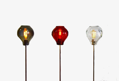 Modern floor lamp with single hand blown crystal shade in smoked glass incandescent lights in various colors
